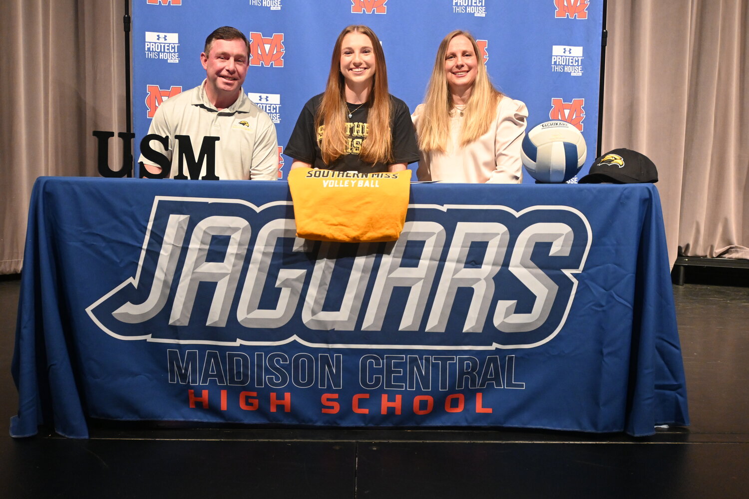 Madison Central High School senior Lindsey Smith signed a national letter of intent to play volleyball at the University of Southern Mississippi. Seated left to right are Bobby Smith (dad), Smith, and Christie Smith (mom).